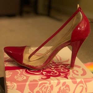 Red pointy toe pumps